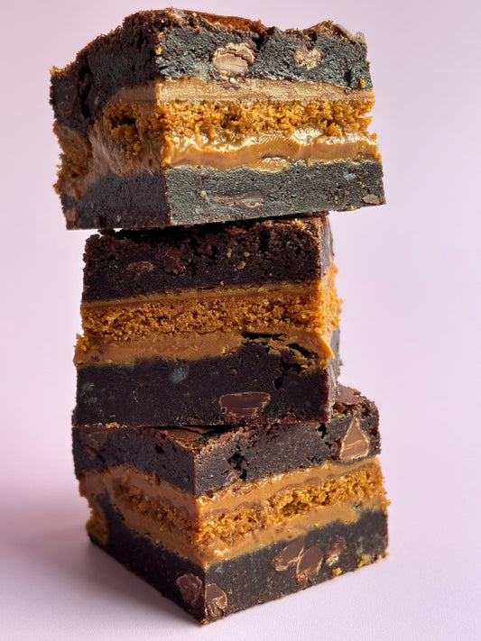 Gooey chocolate brownies stuffed with Biscoff biscuits and Biscoff spread