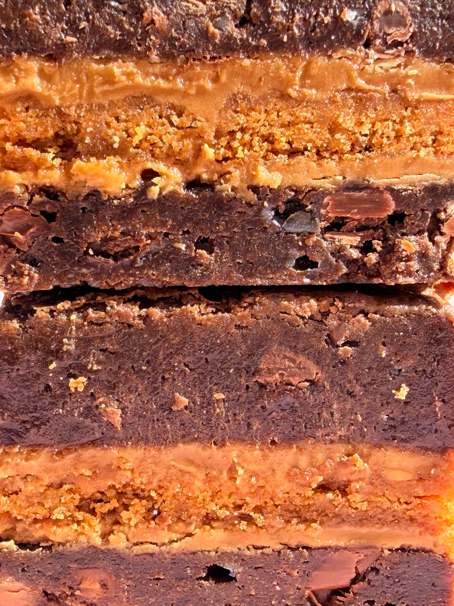 Gooey chocolate brownies stuffed with Biscoff biscuits and Biscoff spread