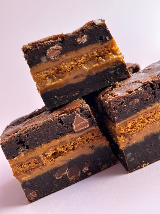 Gooey chocolate brownies stuffed with Biscoff biscuits and Biscoff spread