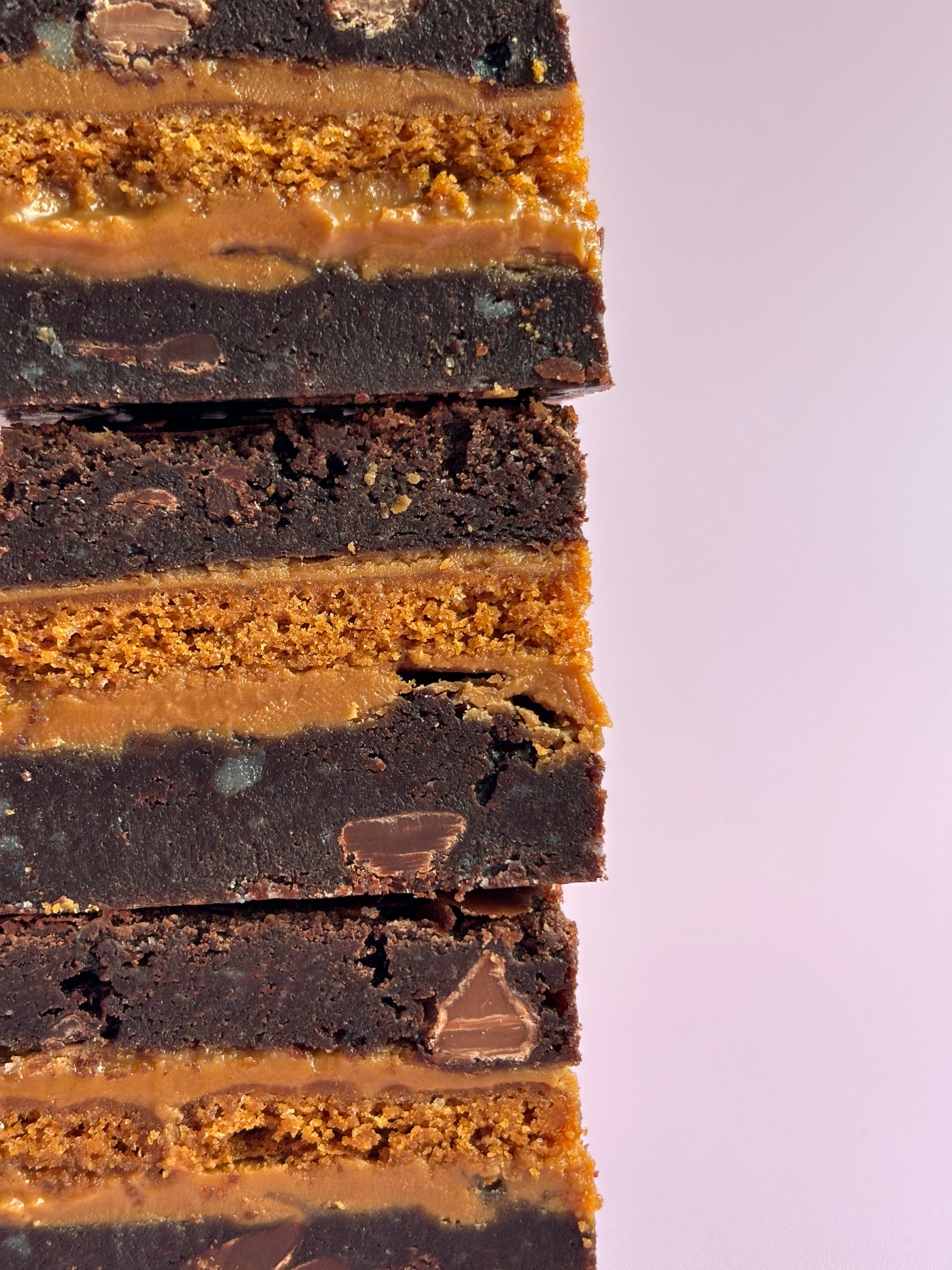 Gooey chocolate brownies stuffed with Biscoff biscuits and Biscoff spread