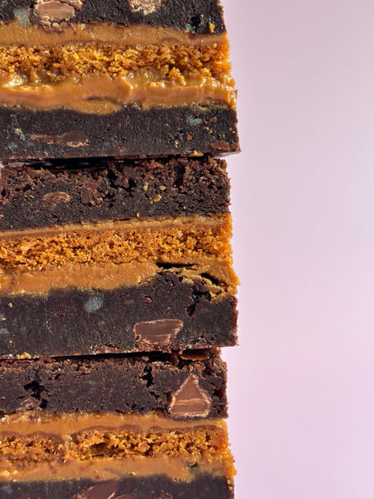 Gooey chocolate brownies stuffed with Biscoff biscuits and Biscoff spread