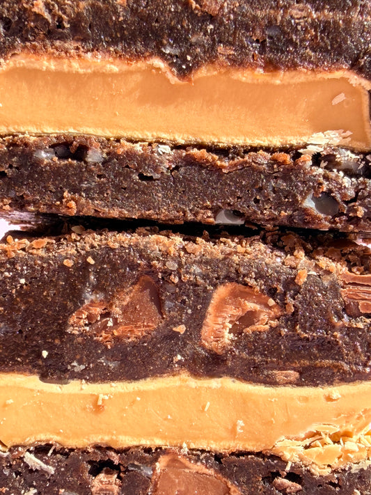 Fudgy chocolate brownies stuffed with Caramilk chocolate blocks