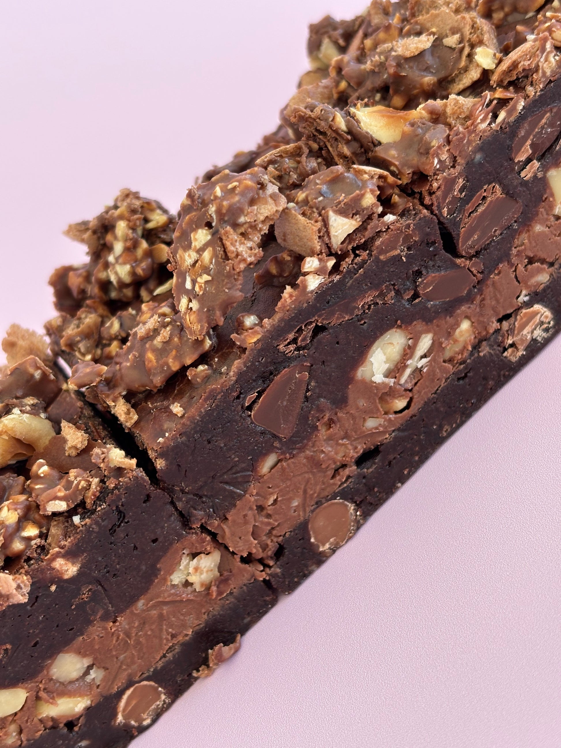 Fudgy chocolate brownies stuffed with Nutella and hazelnuts, and topped with crushed Ferrero Rochers.