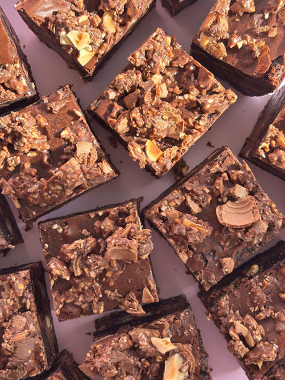 Fudgy chocolate brownies stuffed with Nutella and hazelnuts, and topped with crushed Ferrero Rochers.