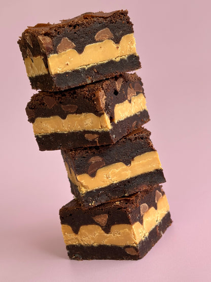 Fudgy gluten-friendly chocolate brownies stuffed with Caramilk chocolate blocks