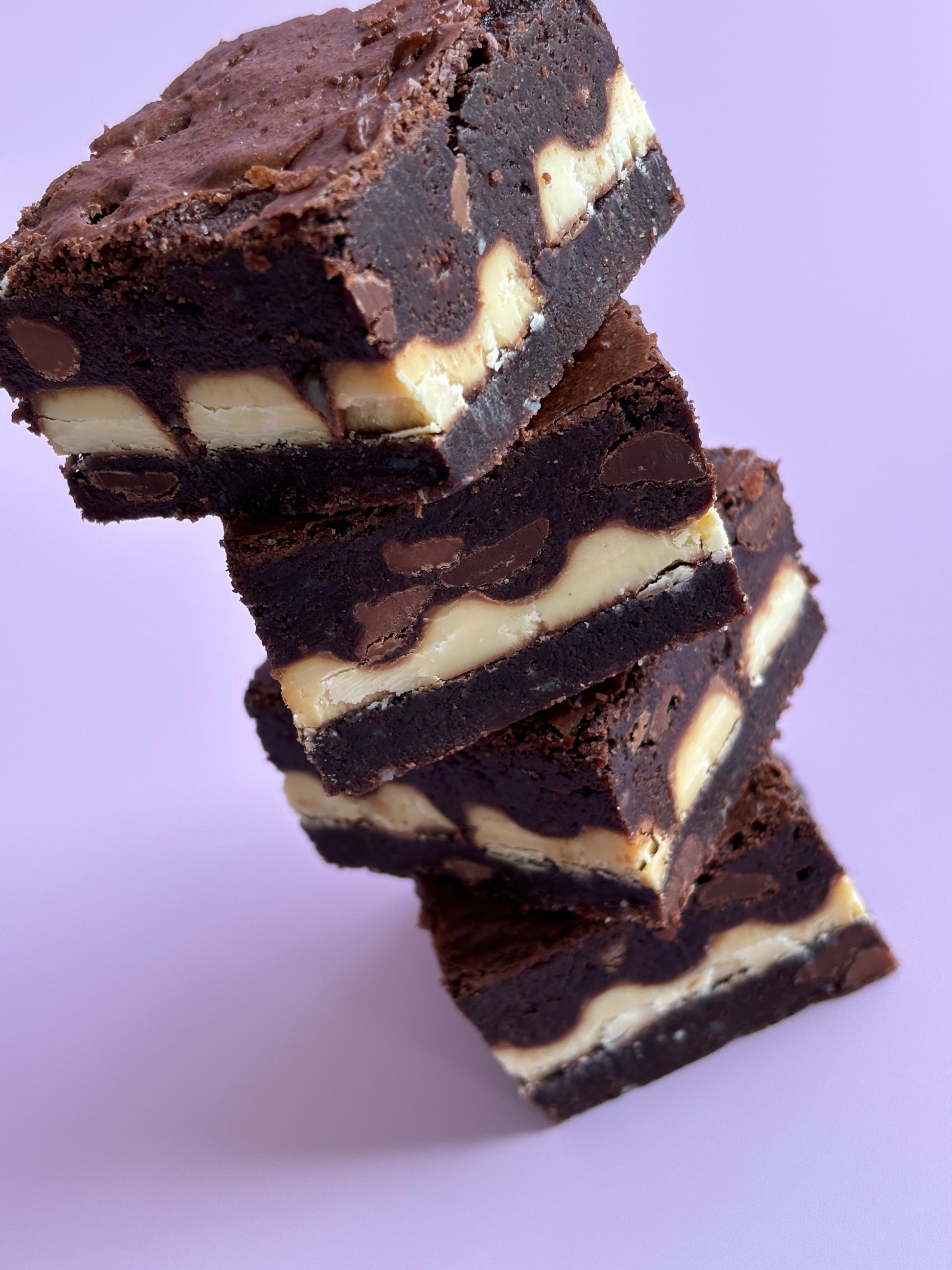 Fudgy chocolate gluten-friendly brownies stuffed with a layer of Kinder chocolate bars