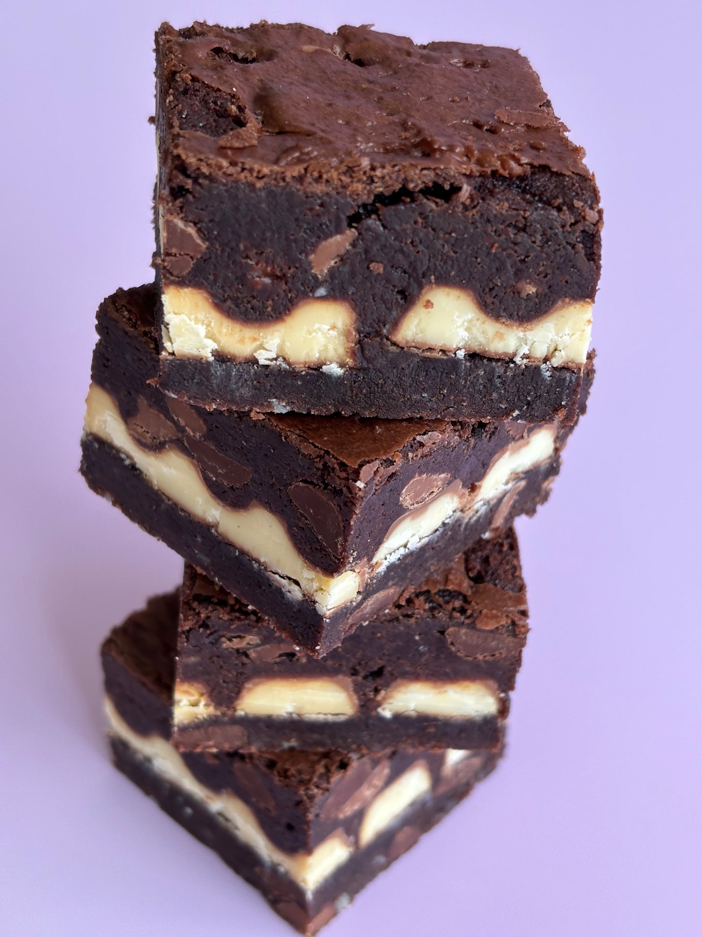 Fudgy chocolate gluten-friendly brownies stuffed with a layer of Kinder chocolate bars