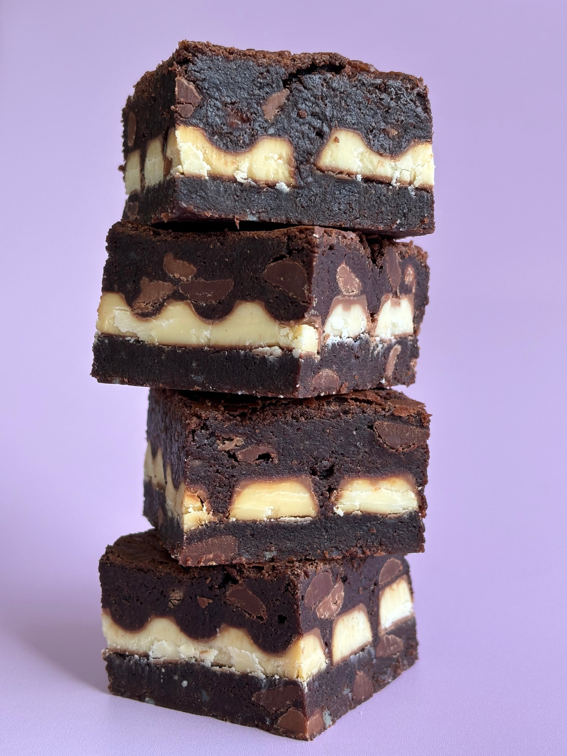 Fudgy chocolate gluten-friendly brownies stuffed with a layer of Kinder chocolate bars