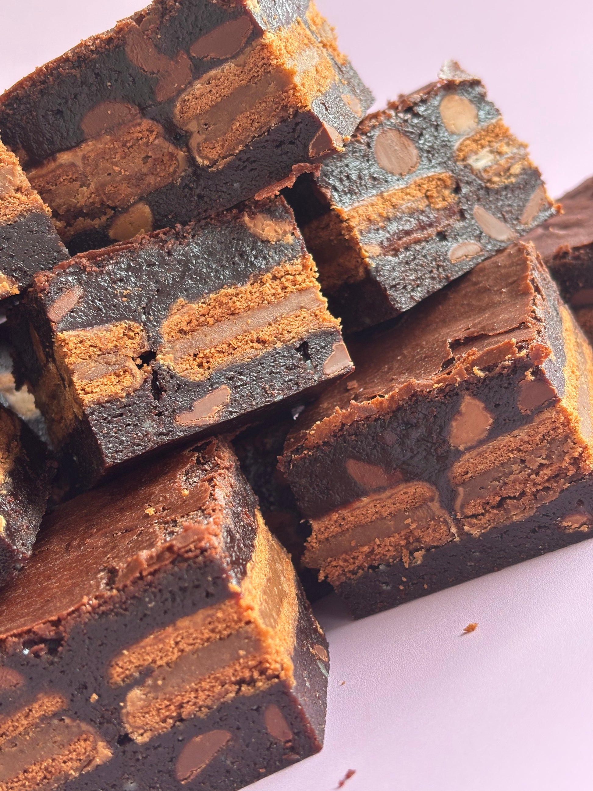 Fudgy chocolate gluten-friendly brownies stuffed with a layer of gluten-free Tim Tam biscuits.