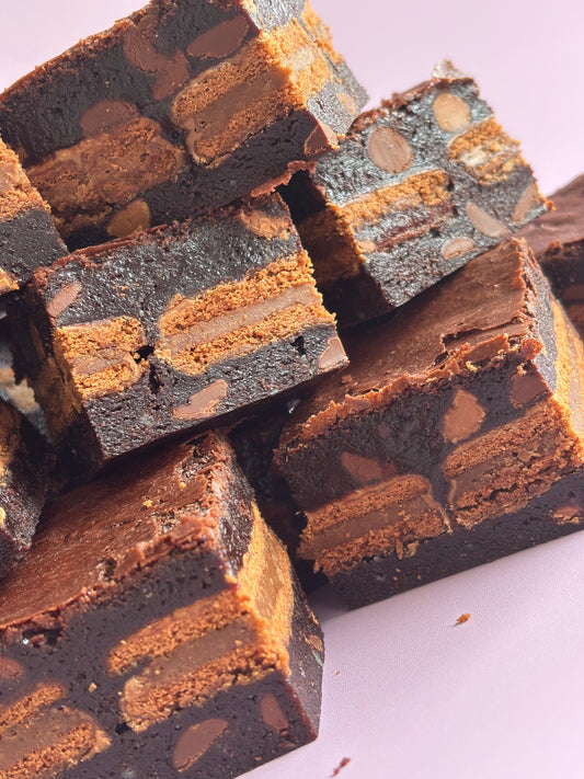 Fudgy chocolate gluten-friendly brownies stuffed with a layer of gluten-free Tim Tam biscuits.