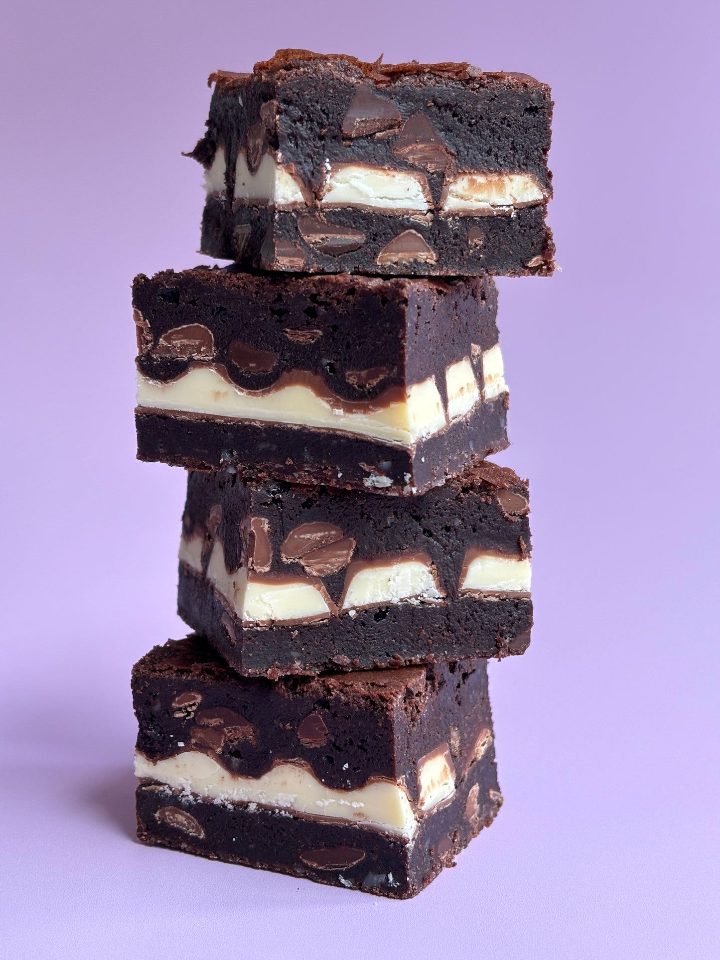 Fudgy chocolate brownies stuffed with a layer of Kinder bars.