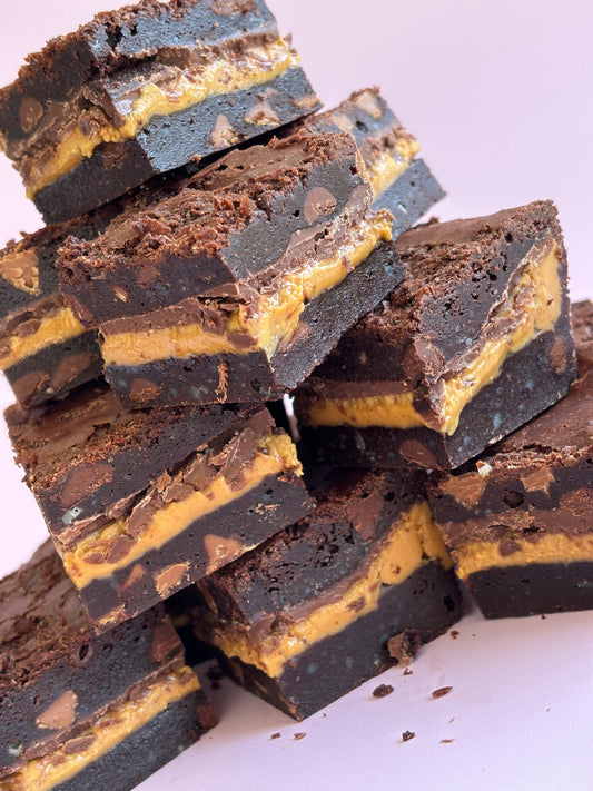 Decadent chocolate brownies stuffed with a layer or milk chocolate and gooey peanut butter